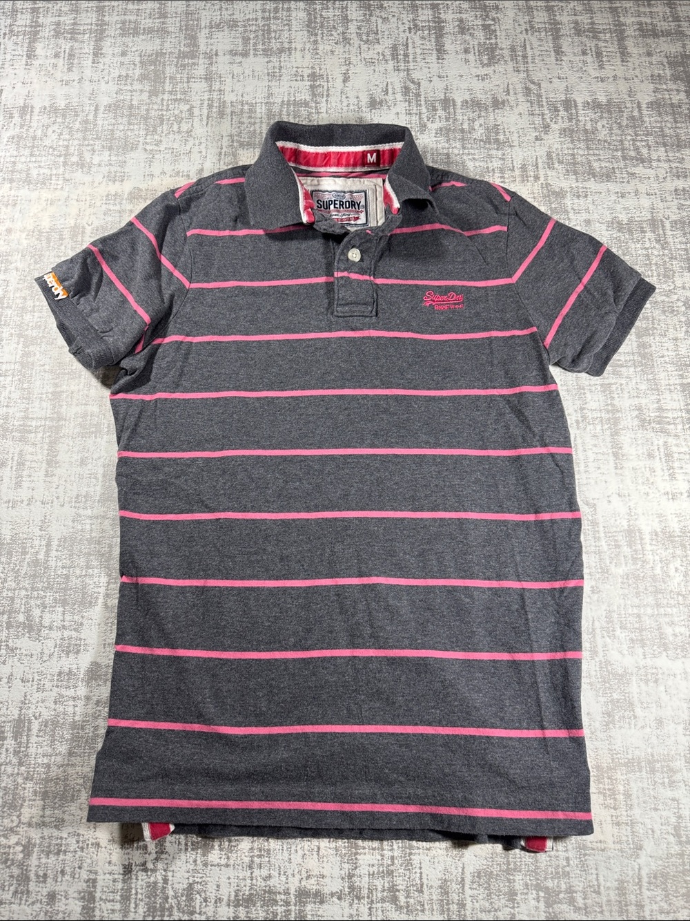 Superdry Tokyo Japan Men's Dark Gray Polo with Pink Stripes 25.5X18 ptp